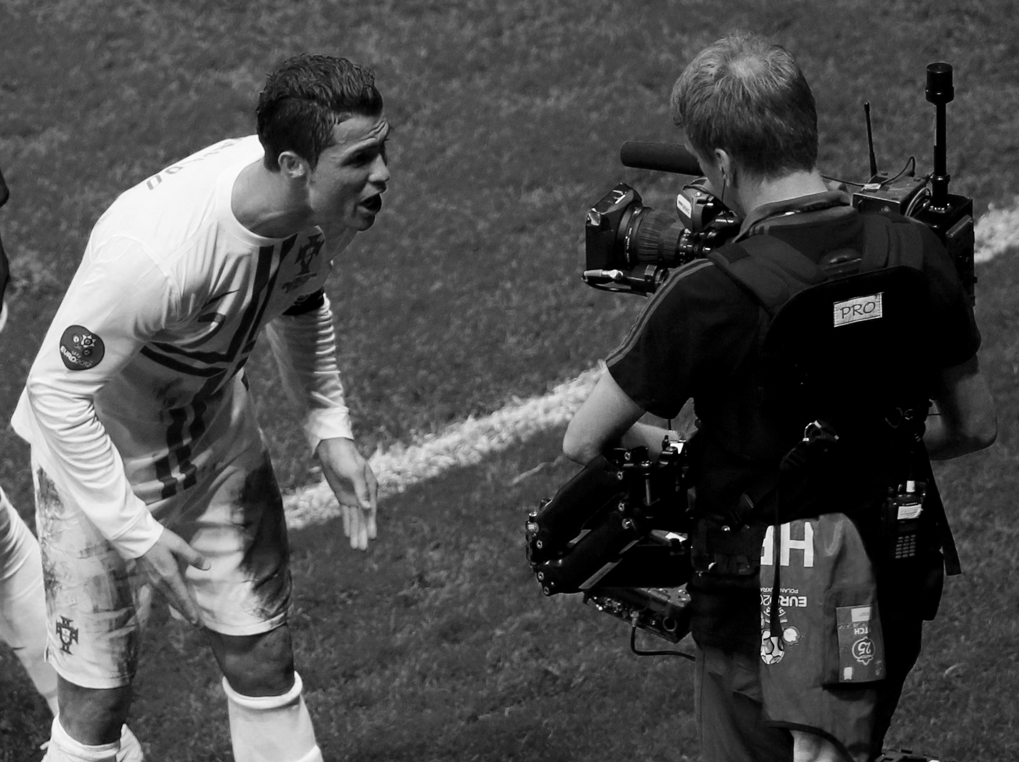 Portugal's Cristiano Ronaldo looks at a TV camera as he celebrates after scoring a goal against Czech Republic during their Euro 2012 quarter final soccer match in Warsaw, June 21, 2012.             REUTERS/Leonhard Foeger (POLAND  - Tags: SPORT SOCCER)