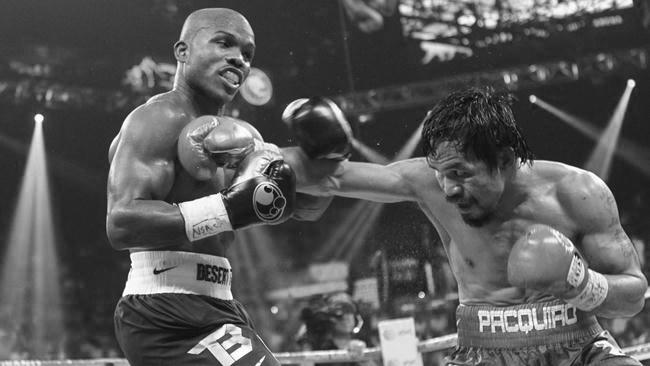 Timothy Bradley Jr. (L) of the U.S. exchanges blows with WBO welterweight champion Manny Pacquiao of the Philippines during their title fight at the MGM Grand Garden Arena in Las Vegas, Nevada June 9, 2012. REUTERS/Steve Marcus (UNITED STATES - Tags: SPORT BOXING)