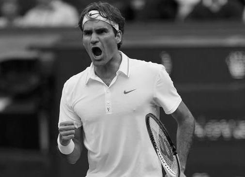 Roger Federer of Switzerland reacts to winning the third set during his men's semi-final tennis match against Novak Djokovic of Serbia at the Wimbledon tennis championships in London July 6, 2012.            REUTERS/Stefan Wermuth (BRITAIN  - Tags: SPORT TENNIS)