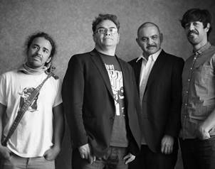 Members of the Mexican band Cafe Tacvba, Emmanuel de Real, right, Enrique Rangel, second right, Jose Alfredo Rangel, second left, and Ruben Albarran, left, pose during a media interview session Wednesday, May 12, 2010 in Shanghai, China. Cafe Tacvba will perform two concerts as part at Shanghai World Expo. (AP Photo/Eugene Hoshiko)