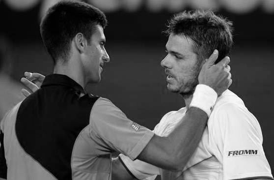 Switzerland's Stanislas Wawrinka (R) shakes hands as he celebrates after victory in his men's singles match against Serbia's Novak Djokovic (L) on day nine at the 2014 Australian Open tennis tournament in Melbourne on January 21, 2014.      IMAGE RESTRICTED TO EDITORIAL USE - STRICTLY NO COMMERCIAL USE              AFP PHOTO / GREG WOOD