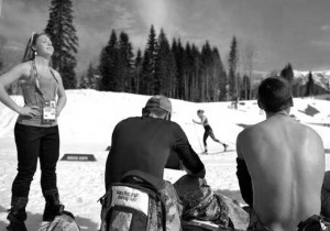 Course preparators enjoy a sunbath before the Men's Cross-Country Skiing 15km Classic at the Laura Cross-Country Ski and Biathlon Center during the Sochi Winter Olympics on February 14, 2014.  AFP PHOTO / ODD ANDERSEN